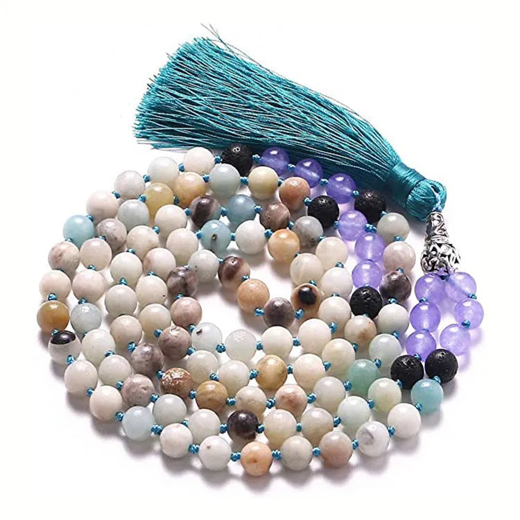 Long multicoloured agate tassel necklace with geometric beads and a flowing pendant.