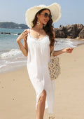 White women's suspender beach dress with hollow crochet detail and a side slit