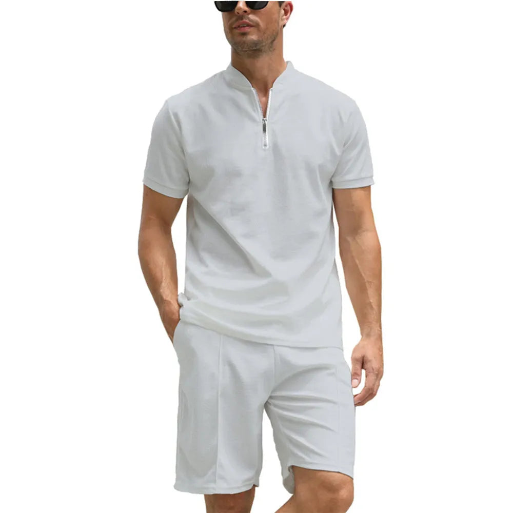 Men's solid colour polo shirt and trouser two-piece set in beaded bird's eye polyester fabric.