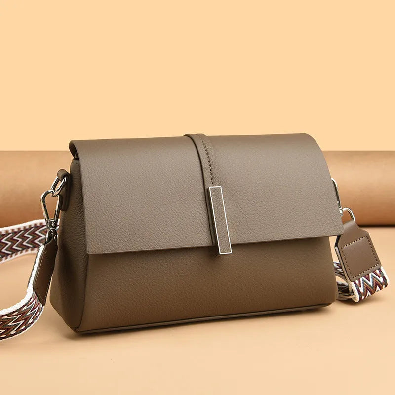 Women's cowhide tote bag in first layer leather, 24x15x9cm, with double shoulder straps, shown in black, gray, or wine red.