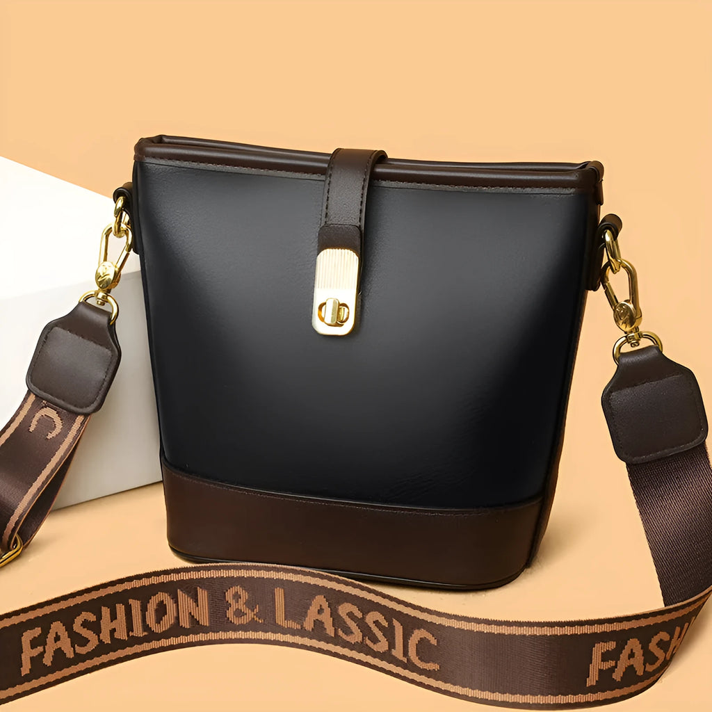 Korean-style black bucket messenger bag showing zipper compartments and adjustable shoulder straps