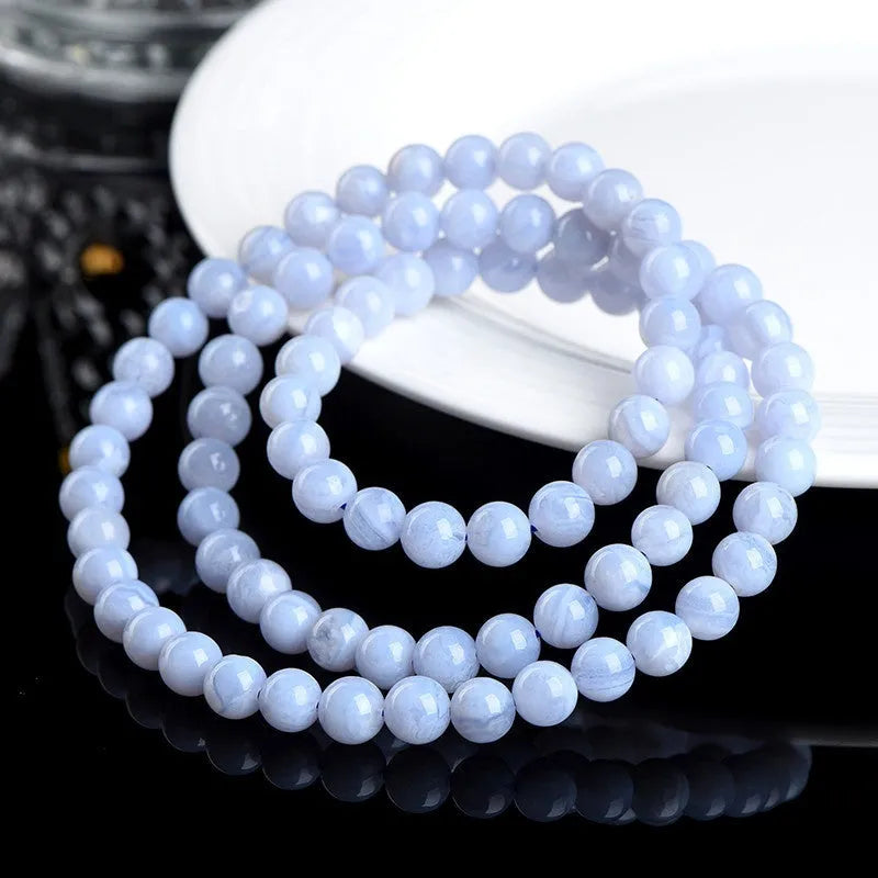 Natural blue agate bracelet with multi-circle patterns and scattered Ruyi elements on wrist