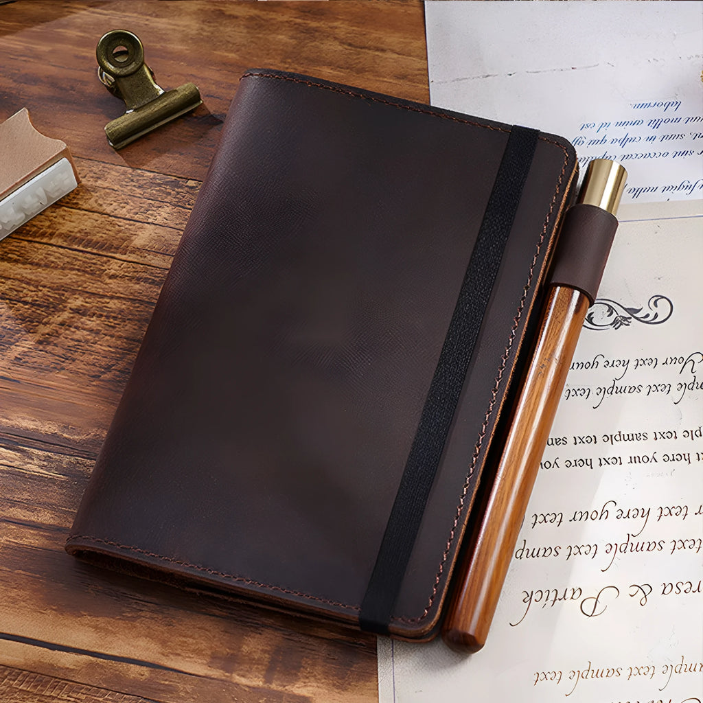 Handmade kraft notebook with a cowhide leather cover, shown open on wood-free paper.