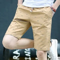 Men's cotton summer shorts in blue with a lace-up front placket, shown on a size chart