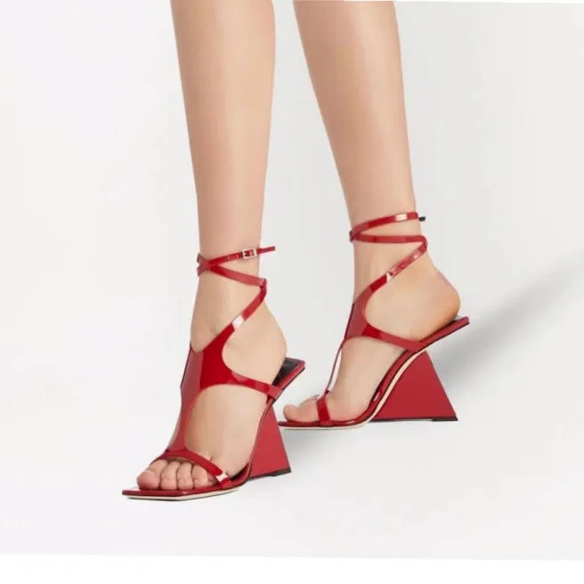 Women's black high heel sandals with a square toe and 9.5cm heel, showing button closure.