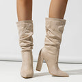 Women's black suede boots with chunky high heel and pointed toe design