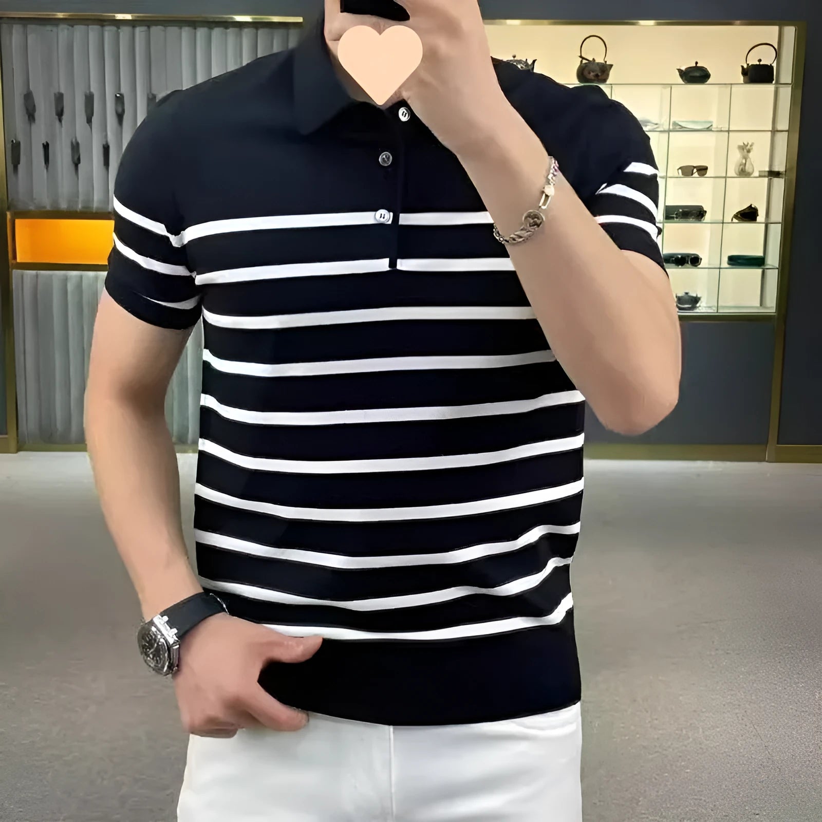 Black and white striped knitted pullover T-shirt with a lapel collar.