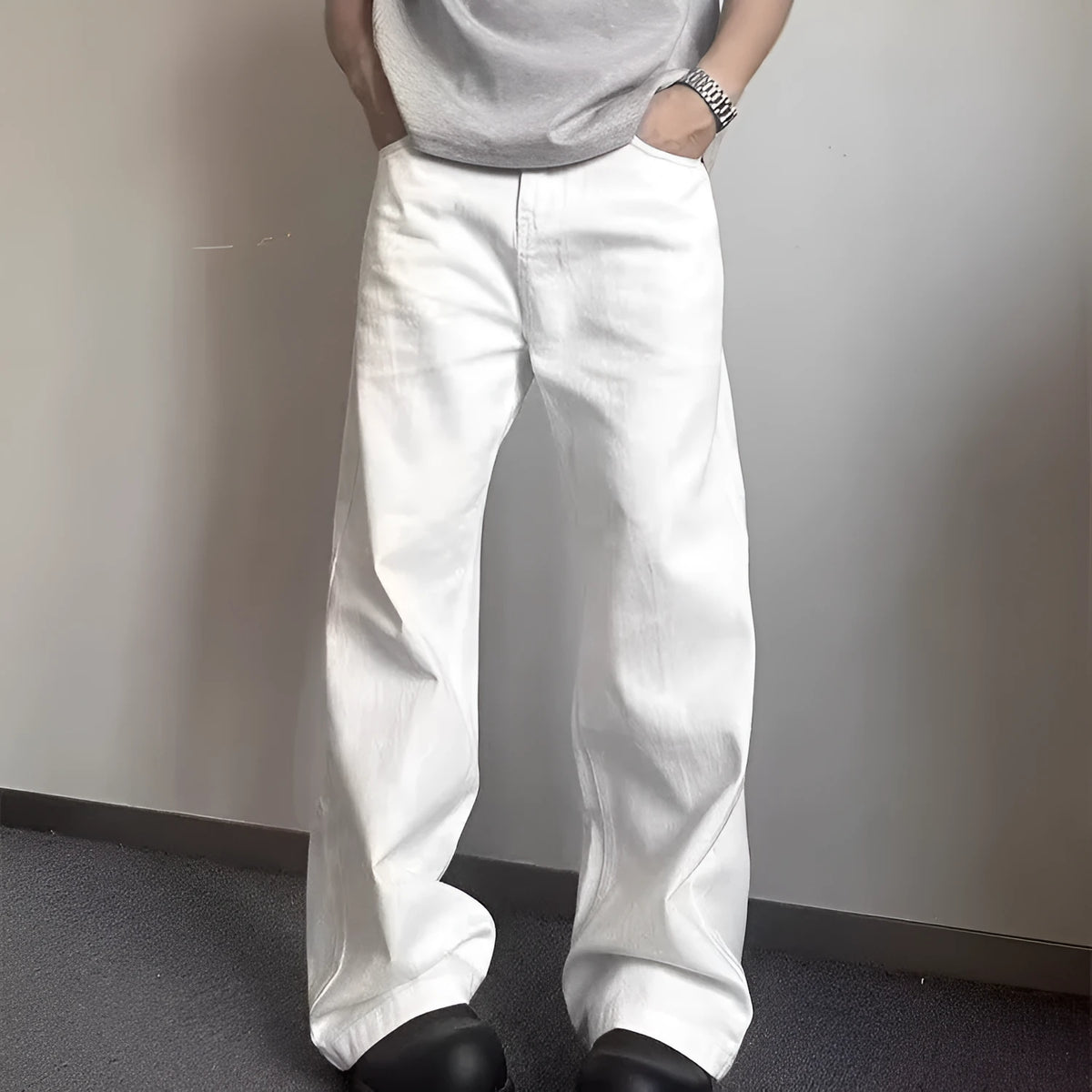 Men's high-grade white loose straight leg denim jeans on a mid-waist.