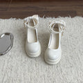Women's beige chunky heel Mary Jane pumps with a round toe and shallow cut on a white background.