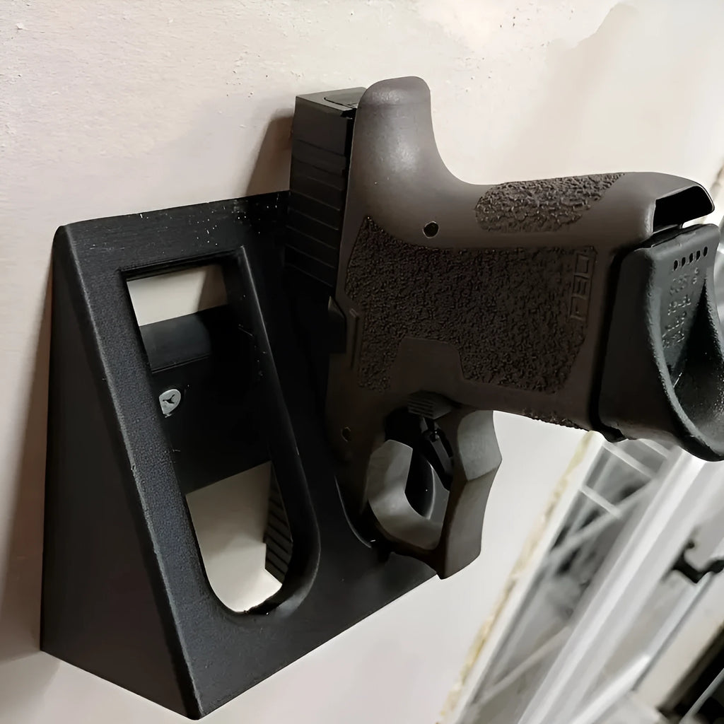 Black plastic punk-style pistol stand for model gun display measuring 10.85cm by 7.6cm