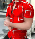 Man wearing a slim fit short sleeve shirt with a colourful 3D floral beach print.