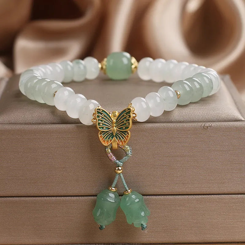 Green women's bracelet with Tian Shan Cui abacus beads and retro butterfly tassel design