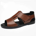 Men's black and brown Roman-style leather sandals with open-toe design and rubber soles