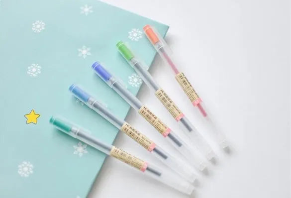 Twelve Muji gel pens with 0.5mm fine tips in a set showing leak prevention mechanism