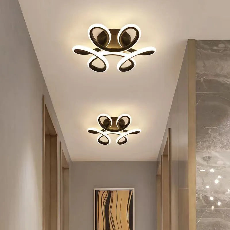 Modern LED corridor ceiling light with silicone shade, shown in black and white butterfly and circular frame designs.