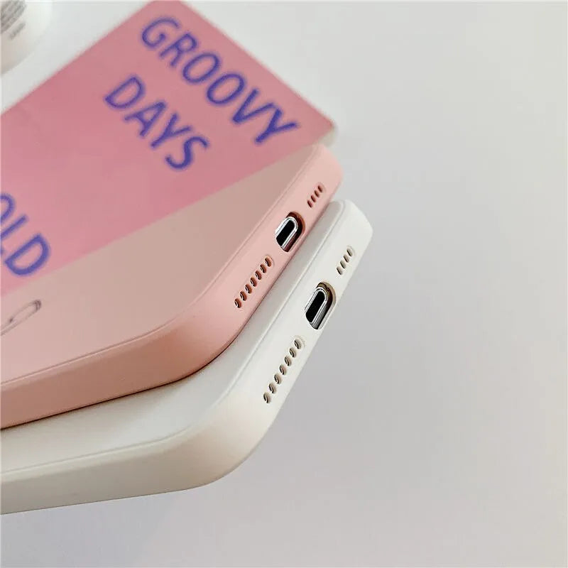 Silicone TPU back cover case for Apple iPhone in a solid colour, showing precise cutouts for camera and ports.