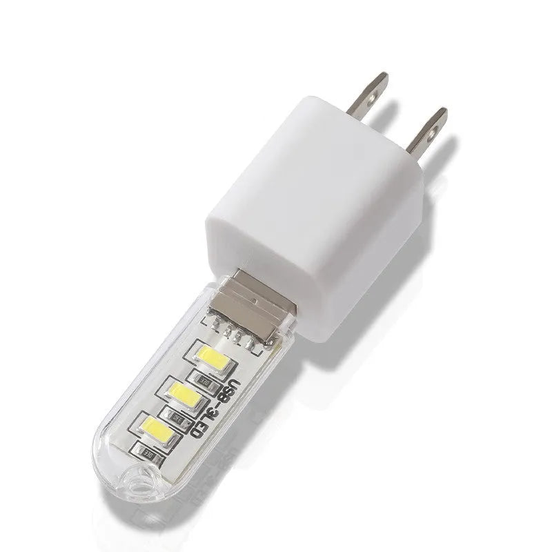 Small white USB-powered LED baby night light showing white and warm light options.