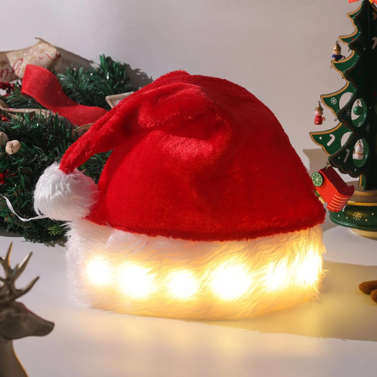 Red and white LED Santa hat with pom-pom and 9 colourful bulbs glowing
