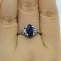 Women's silver alloy ring with geometric hollow pattern and zircon detailing