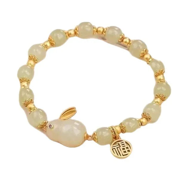 Green jade and black cord women's bracelet with fu character and hare pendant charms