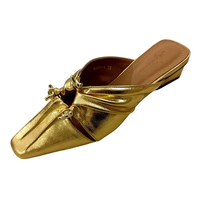Women's genuine leather slipper with a square toe in a gold colour, showing the low heel and slip-on design.