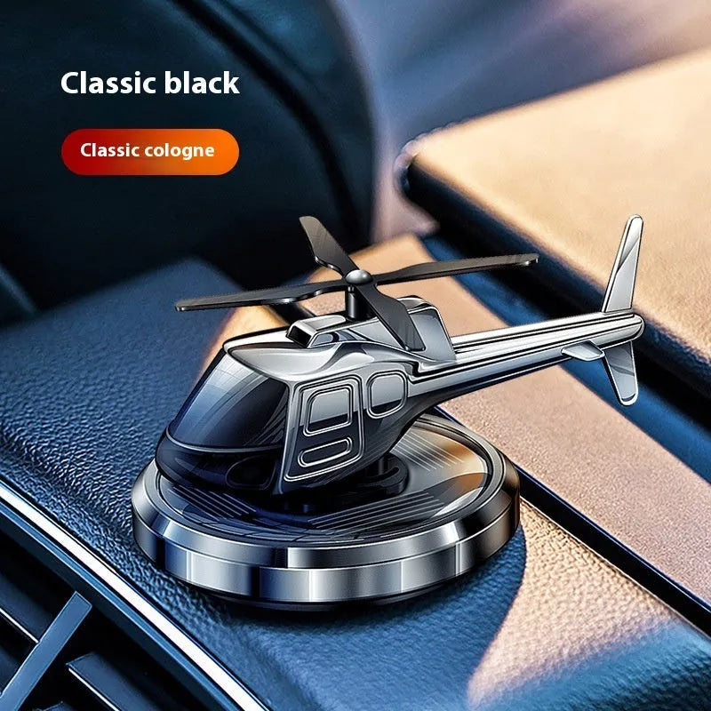Solar-powered metal helicopter car perfume ornament rotating on dashboard