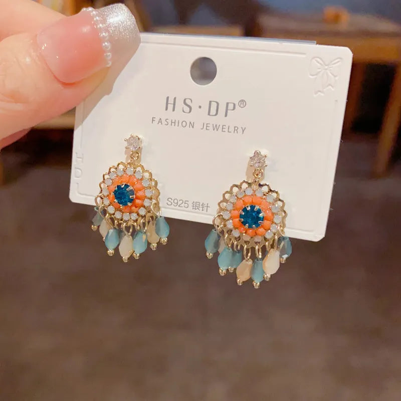 Blue diamond round crystal tassel earrings with thick gold plating and geometric design on copper base