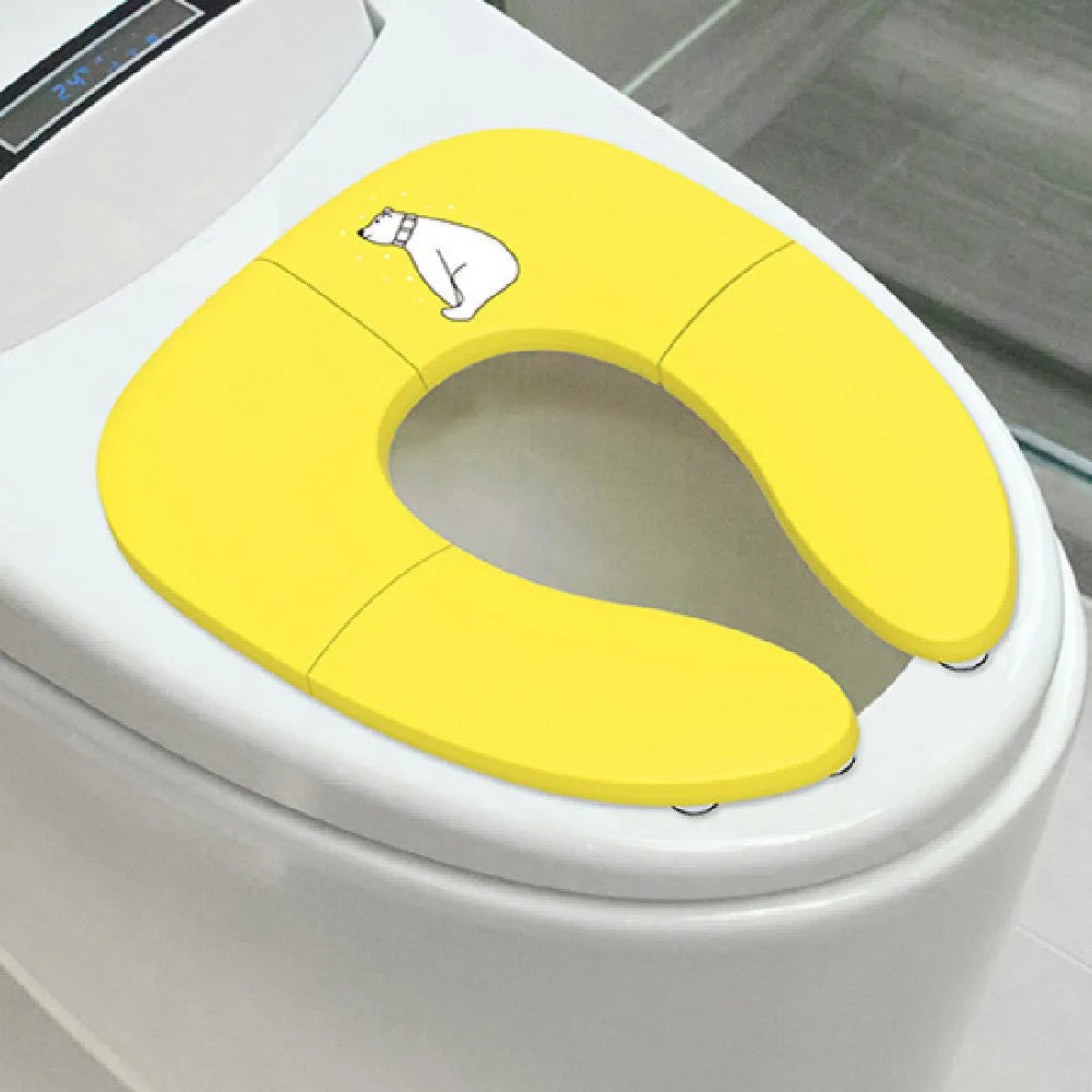 Foldable baby travel potty seat in pink, yellow, blue colours on white background