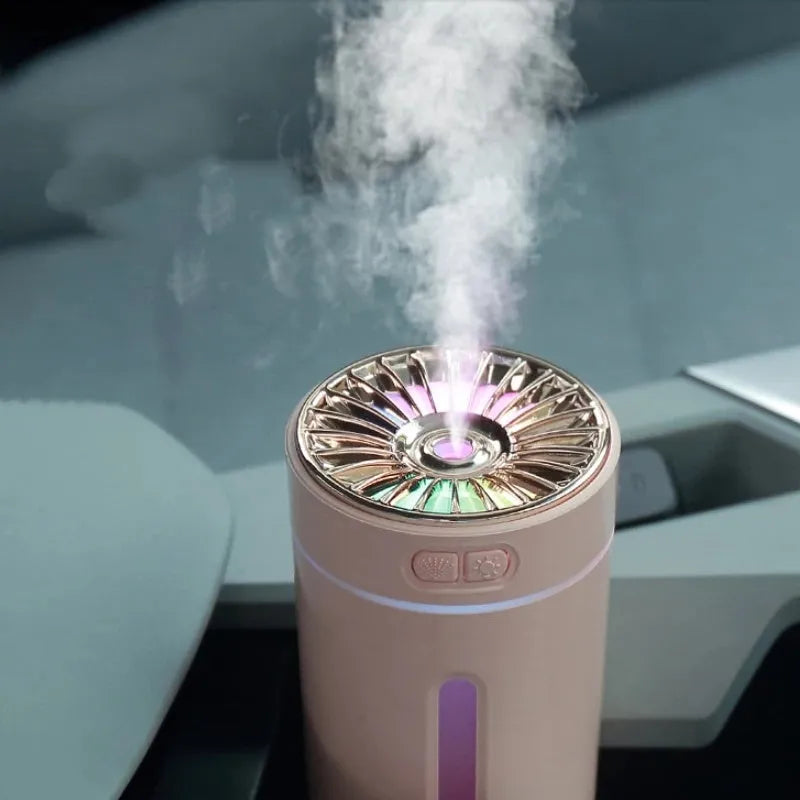 Black portable USB humidifier with colourful lights on car dashboard