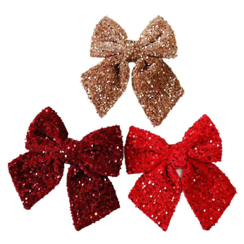 Polyester 25cm red paillette sequin bow Christmas decoration pendant hanging on a white background