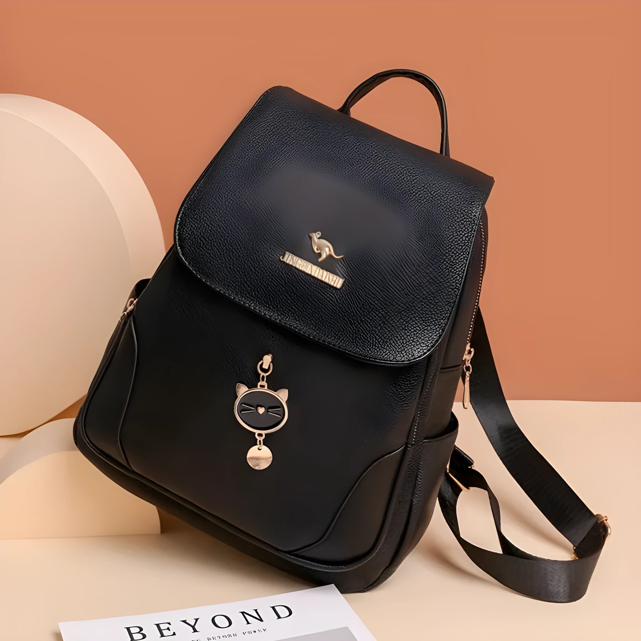 Casual women's leather backpack in black with textured pu finish and three-dimensional pocket design