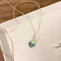 Women's coloured glaze pendant necklace on cotton linen clavicle chain with world style design