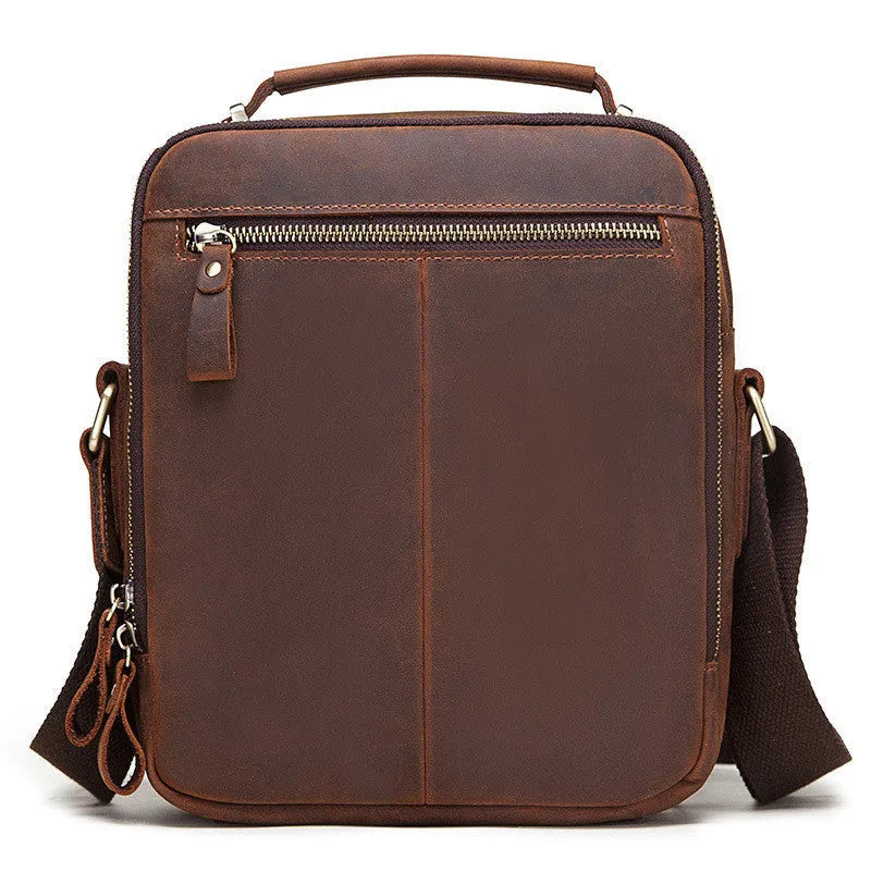 Men's brown Crazy Horse leather crossbody bag with single shoulder strap showing visible sewing lines