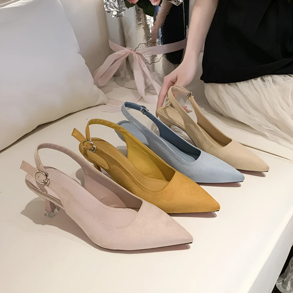 Women's apricot suede pointed-toe stiletto high heels on a light background.
