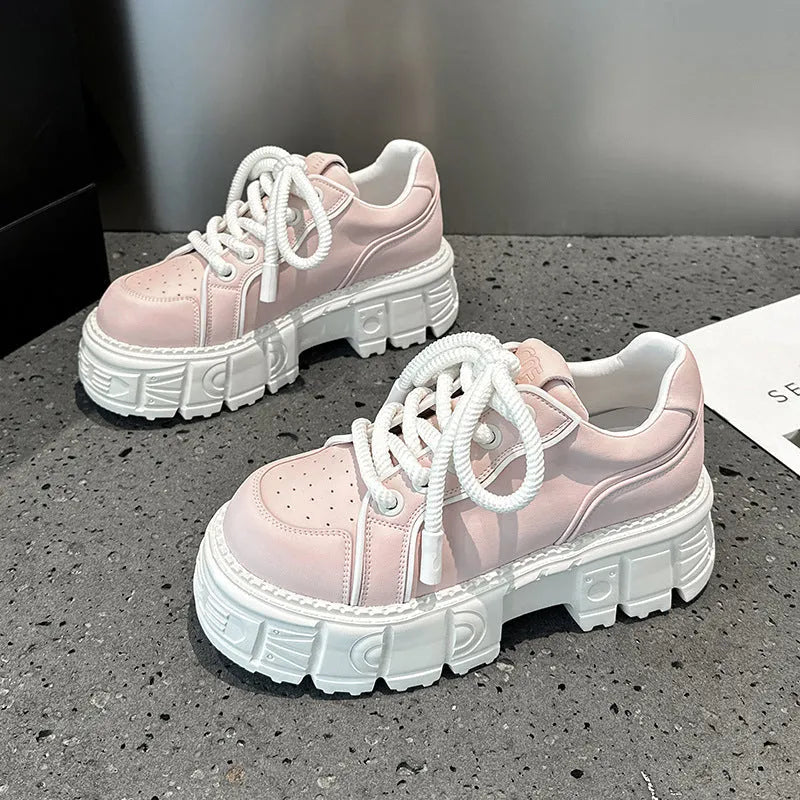 Women's beige casual leather shoes with a spring muffin heel on a rubber foam sole.