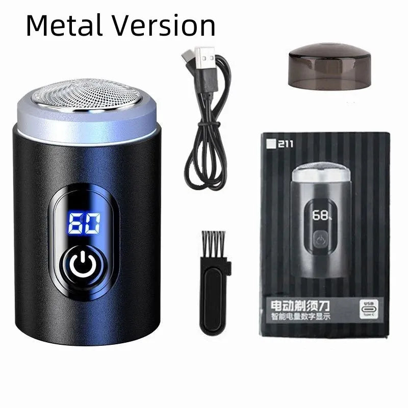 Black portable USB rechargeable shaver with cleaning brush and cable on a table.