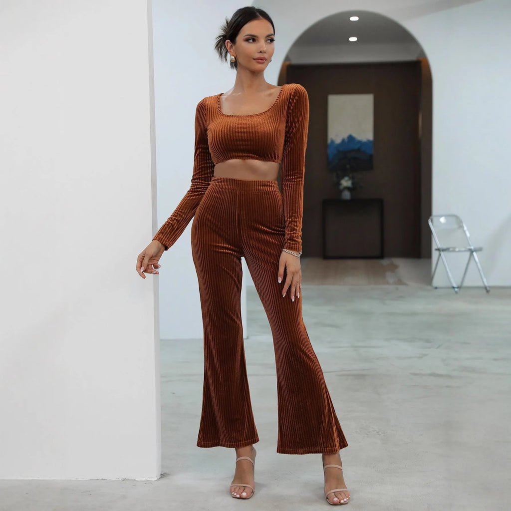 Caramel coloured women's long sleeve sweater and trouser casual set on a hanger.