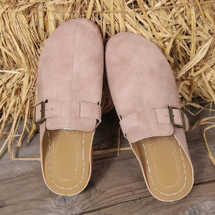 Women's casual wedge slipper in light brown with cloth upper and rubber sole.