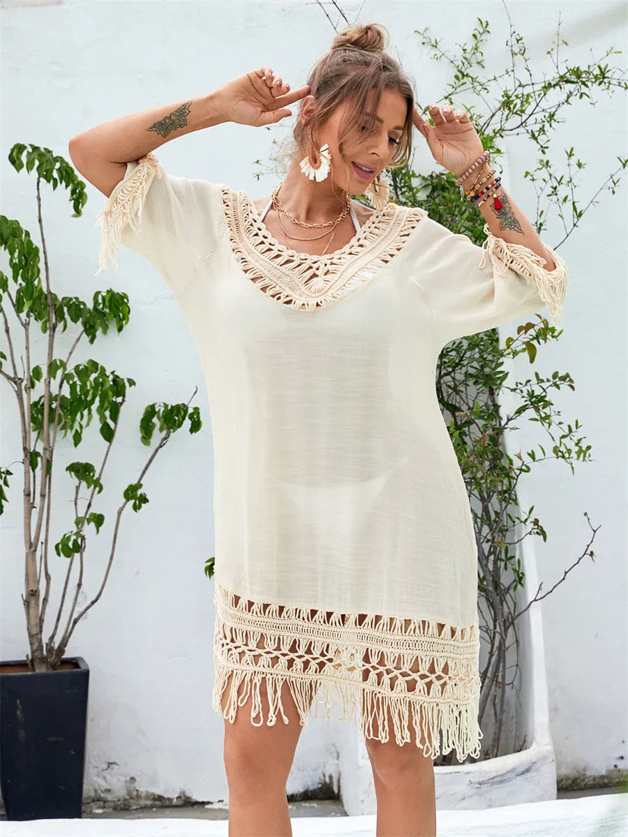 Apricot hand-crocheted long beach dress on a model, showing textured acrylic fabric