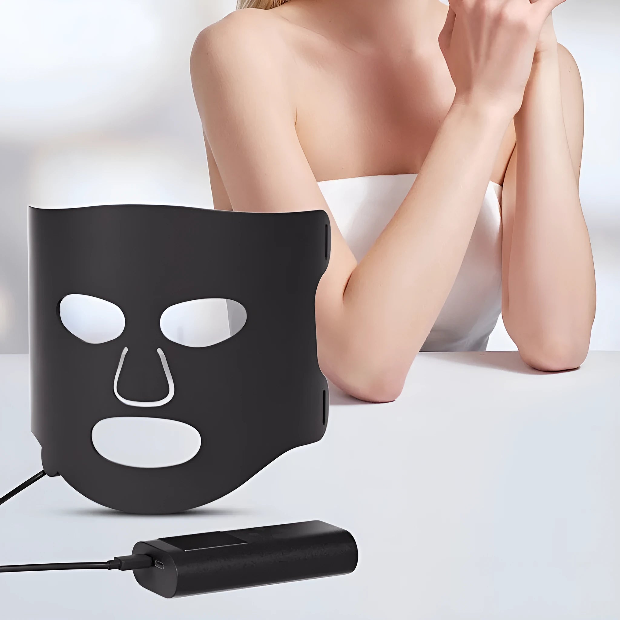 White and black LED phototherapy face mask with controller for seven-colour light skin treatment.