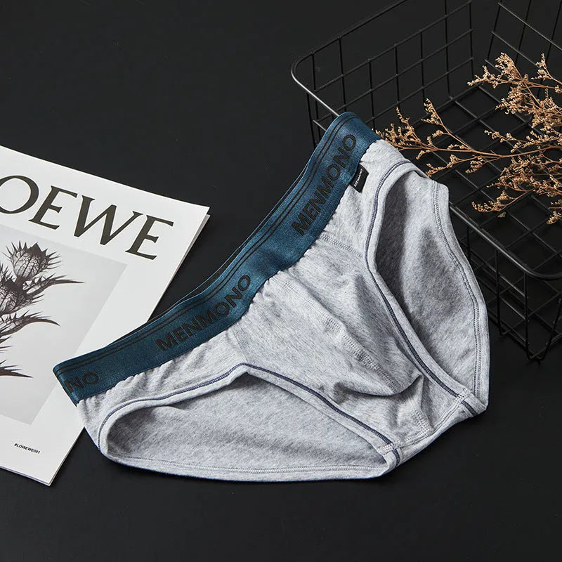 Men's low-waist cotton briefs showing colour options including white/blue, black/red, and grey/green