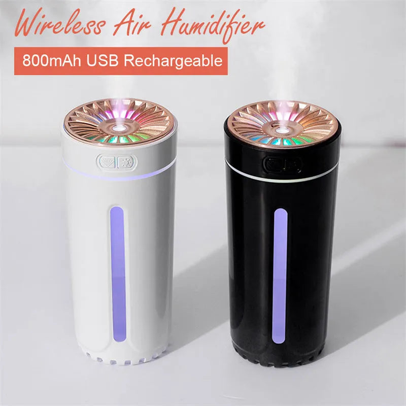 Black portable USB humidifier with colourful lights on car dashboard