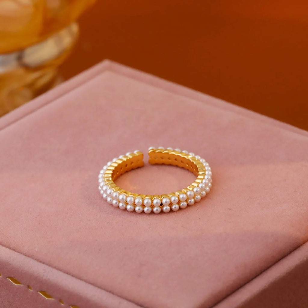 Gold geometric women's ring with a round pearl and open mouth adjustable design.