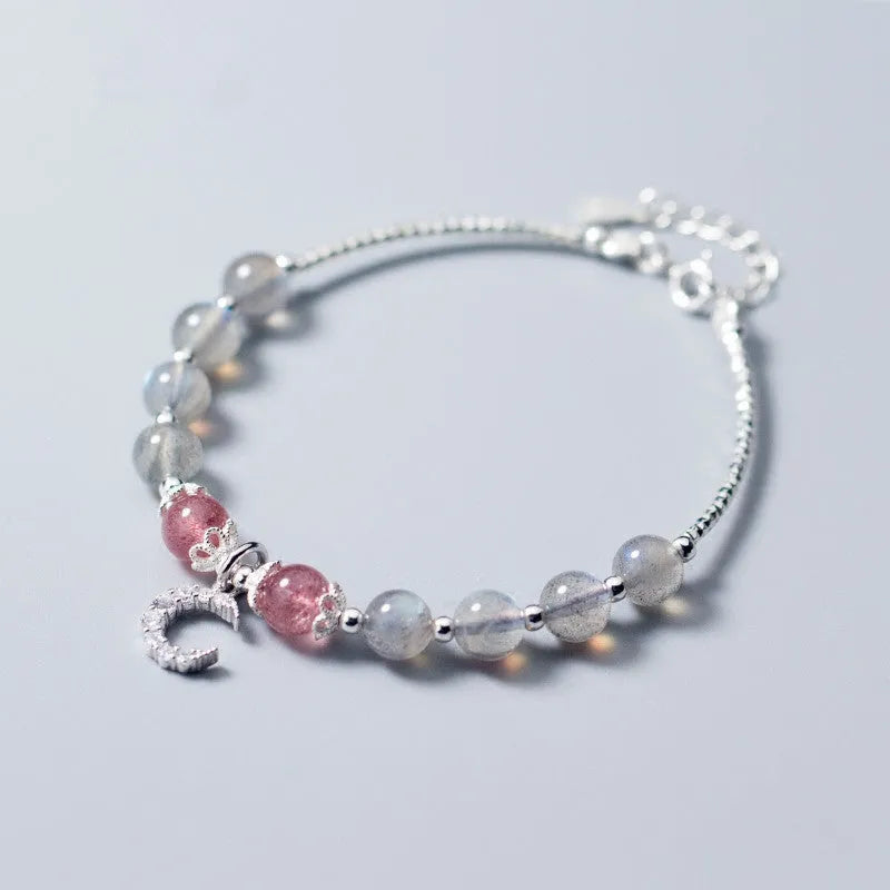 Handmade adjustable bracelet with a natural moonstone centre on a silver-toned chain.