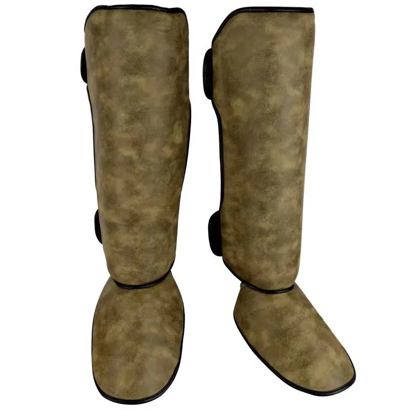 PU vertical thickened fighting boxing shin guards in brown colour on training mat