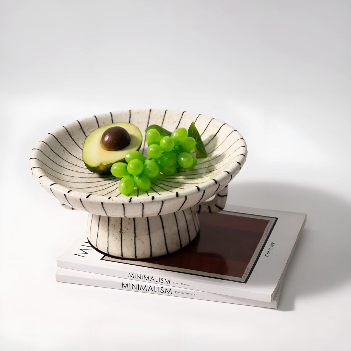 Retro style black and white striped synthetic resin fruit plate on a table.