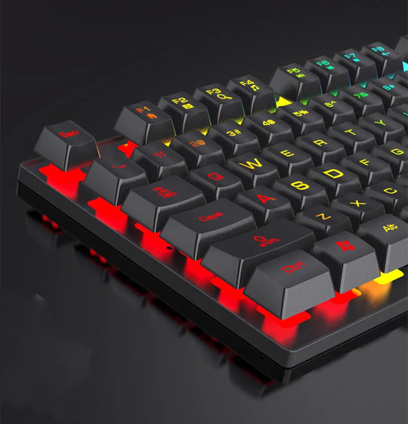 Four piece wired keyboard mouse headset set with mouse pad on desk