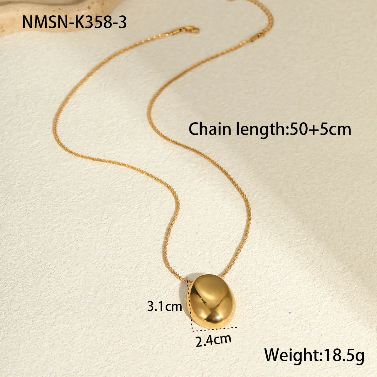 Gold-plated geometric necklace with stainless steel chain on display showing pendant detail