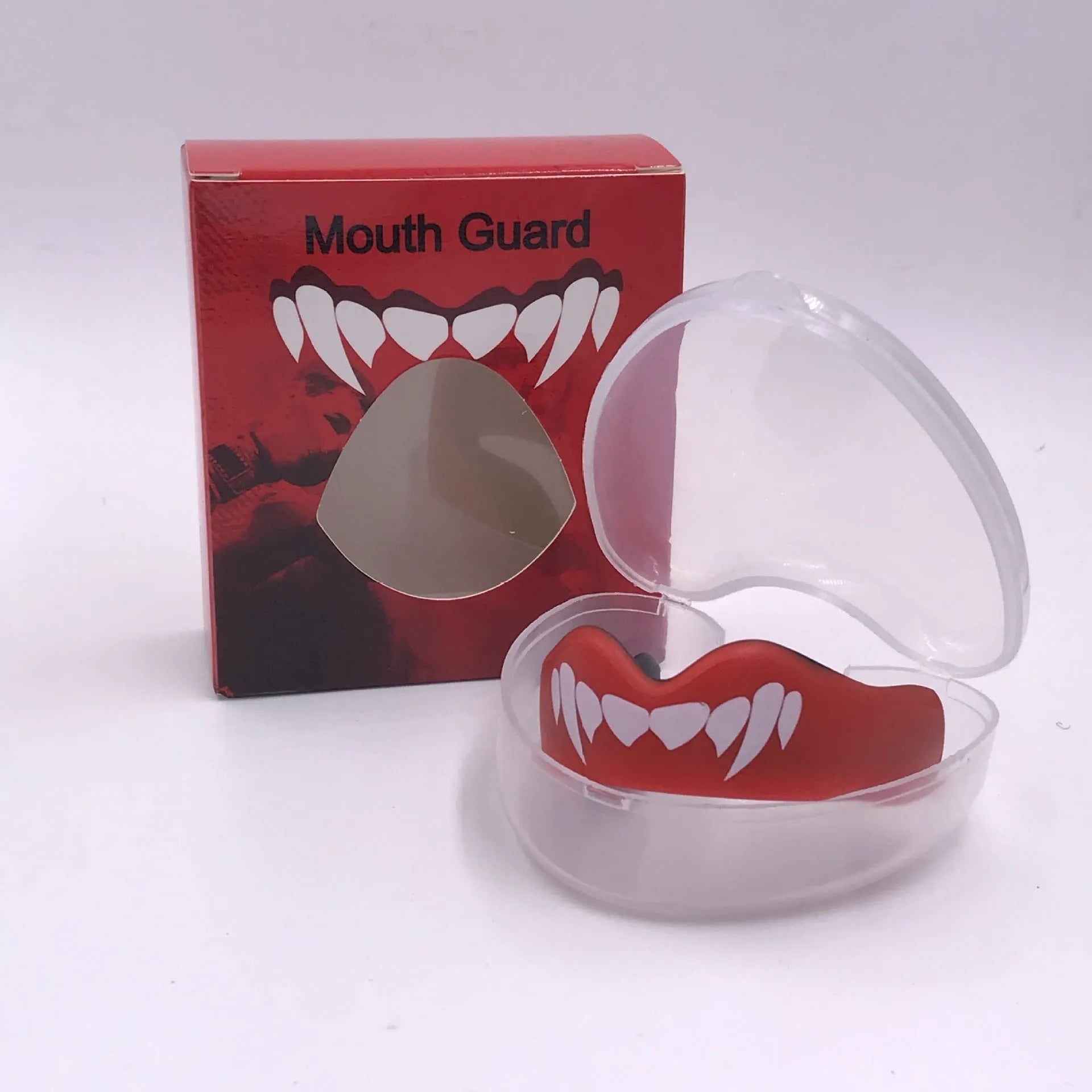 Adult boxing mouthguard with printed tooth design in black and white, for martial arts and fight sports.