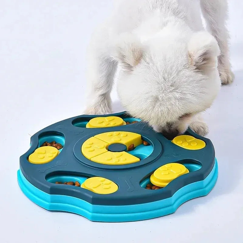 Blue and pink dog puzzle toy feeder bowl for aggressive chewers on a wooden floor.